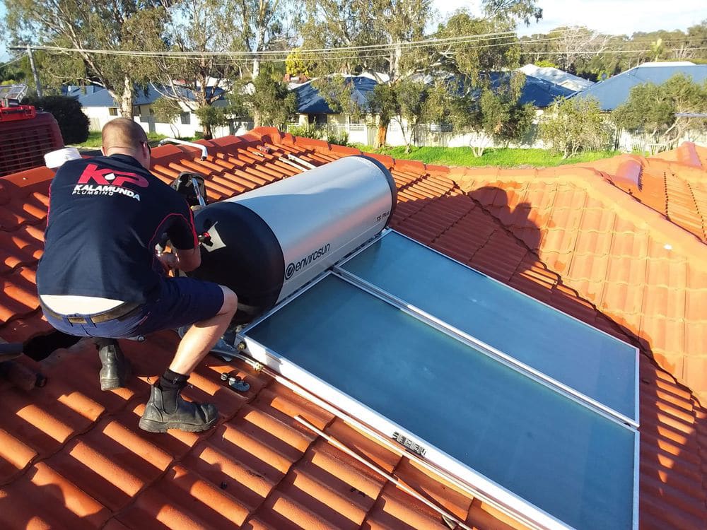 kp plumber on roof installing solar 1